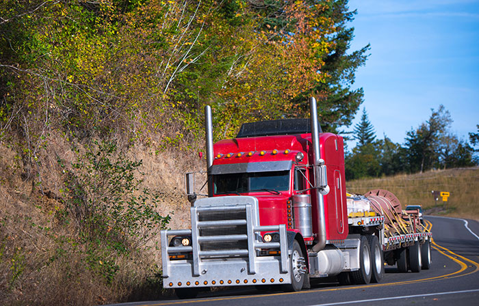 semi truck hauling fabricated item