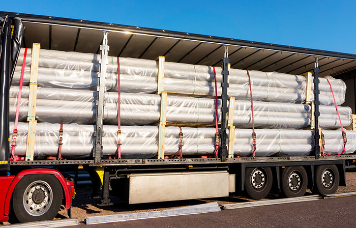 truck loaded with piping